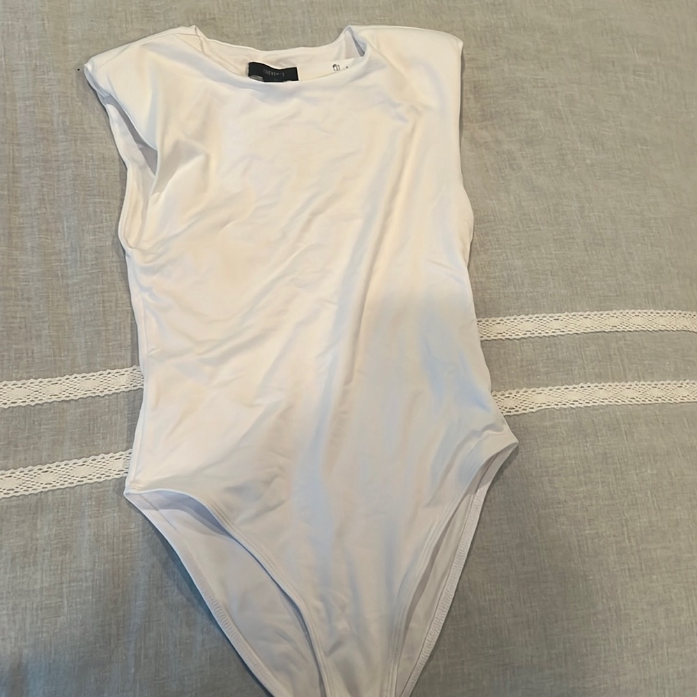 New white bodysuit.